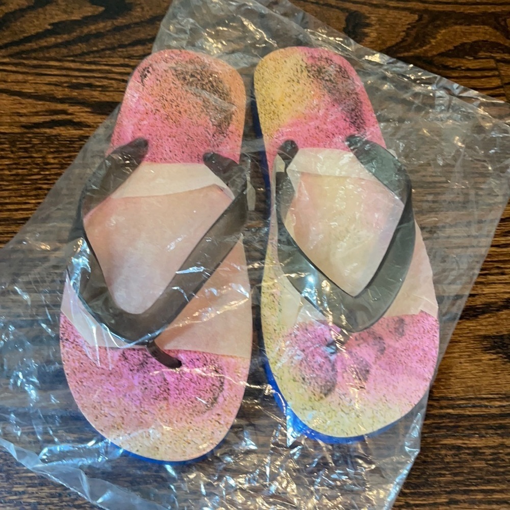 Women’s flip flops. Brand new. Never worn